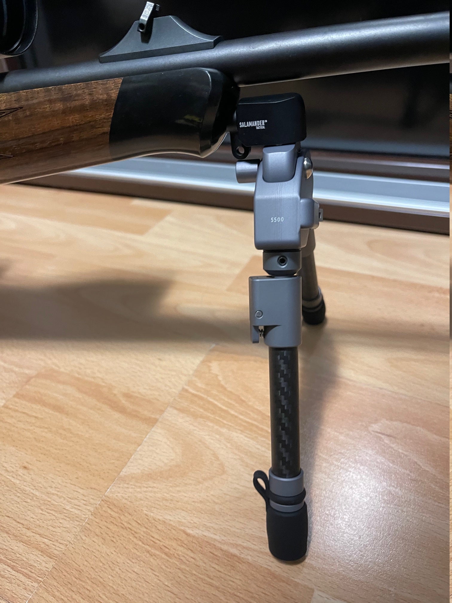 Blaser R8 Professional Adapter for Spartan Javelin bipods mounted on a rifle, showcasing seamless integration and stability.
