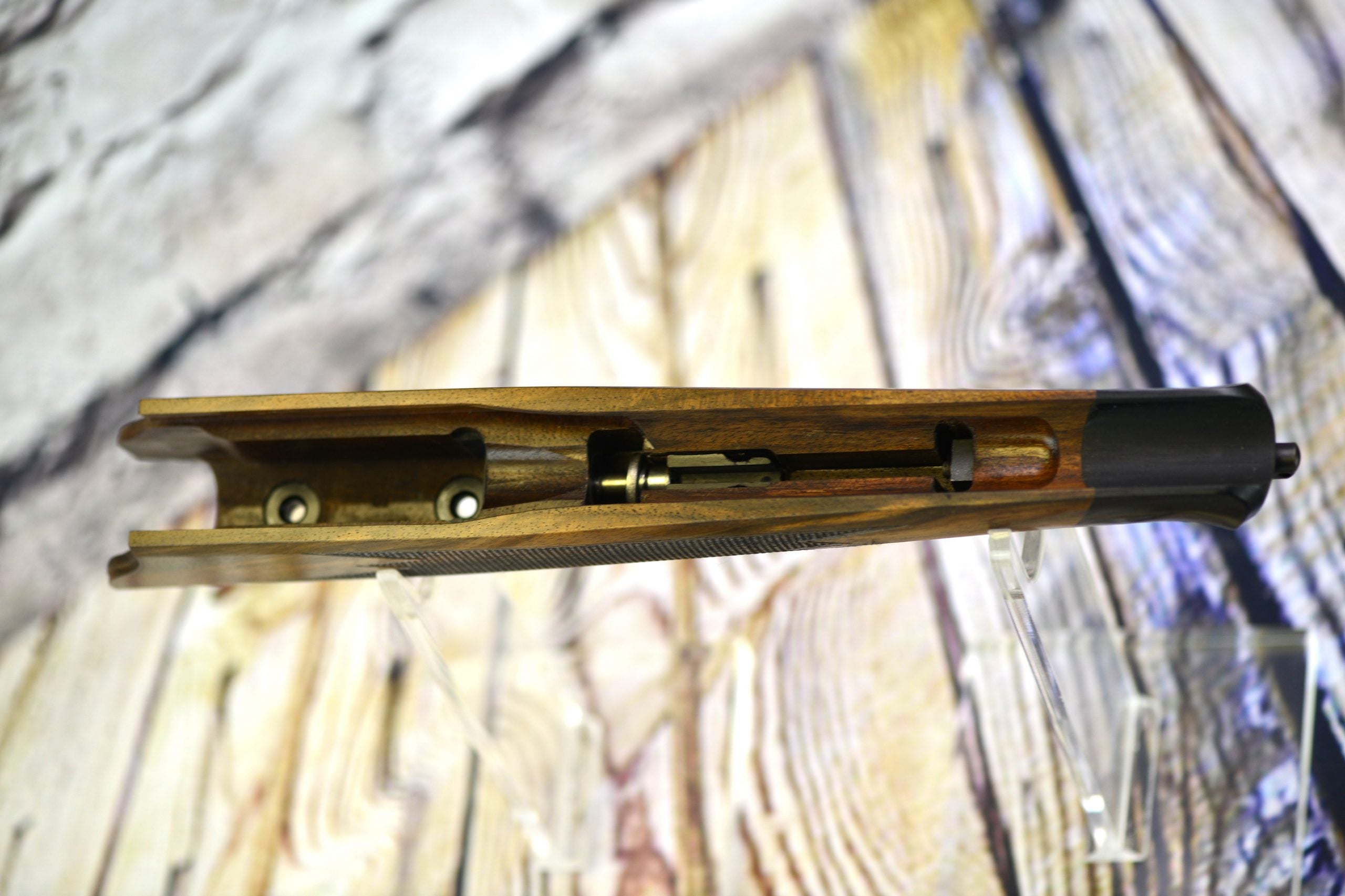 Blaser R8 Professional Adapter for Spartan Javelin bipods displayed on a wooden background.