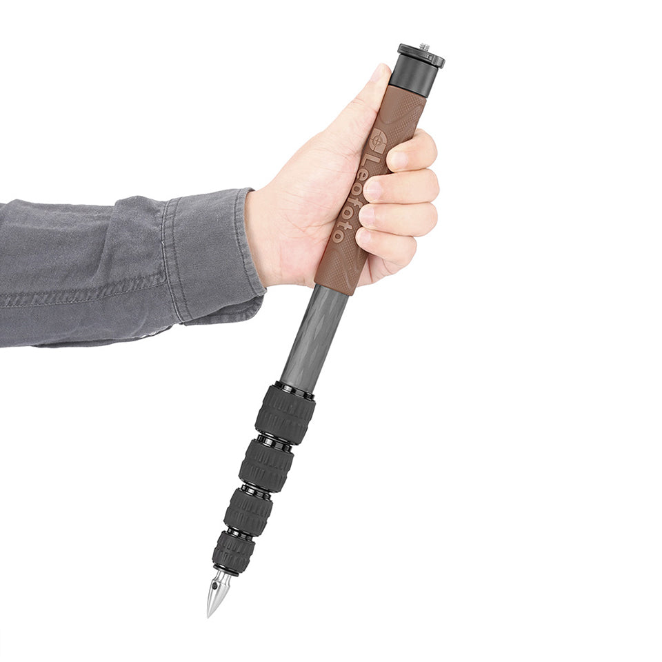 Hand holding the Leofoto GO-125 Monopod showcasing its lightweight design and ergonomic grip.