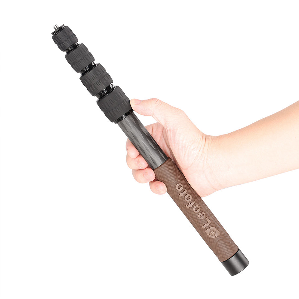 Leofoto GO-125 Monopod being held, showcasing its lightweight design and compact portability.