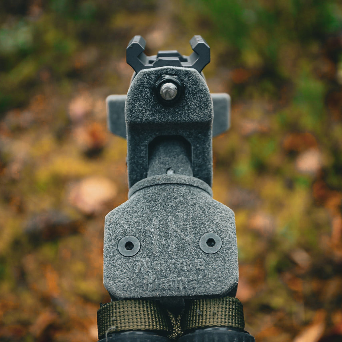 Close-up of the Picatinny clip-on clamp and polymer head on NorneHunt shooting sticks.