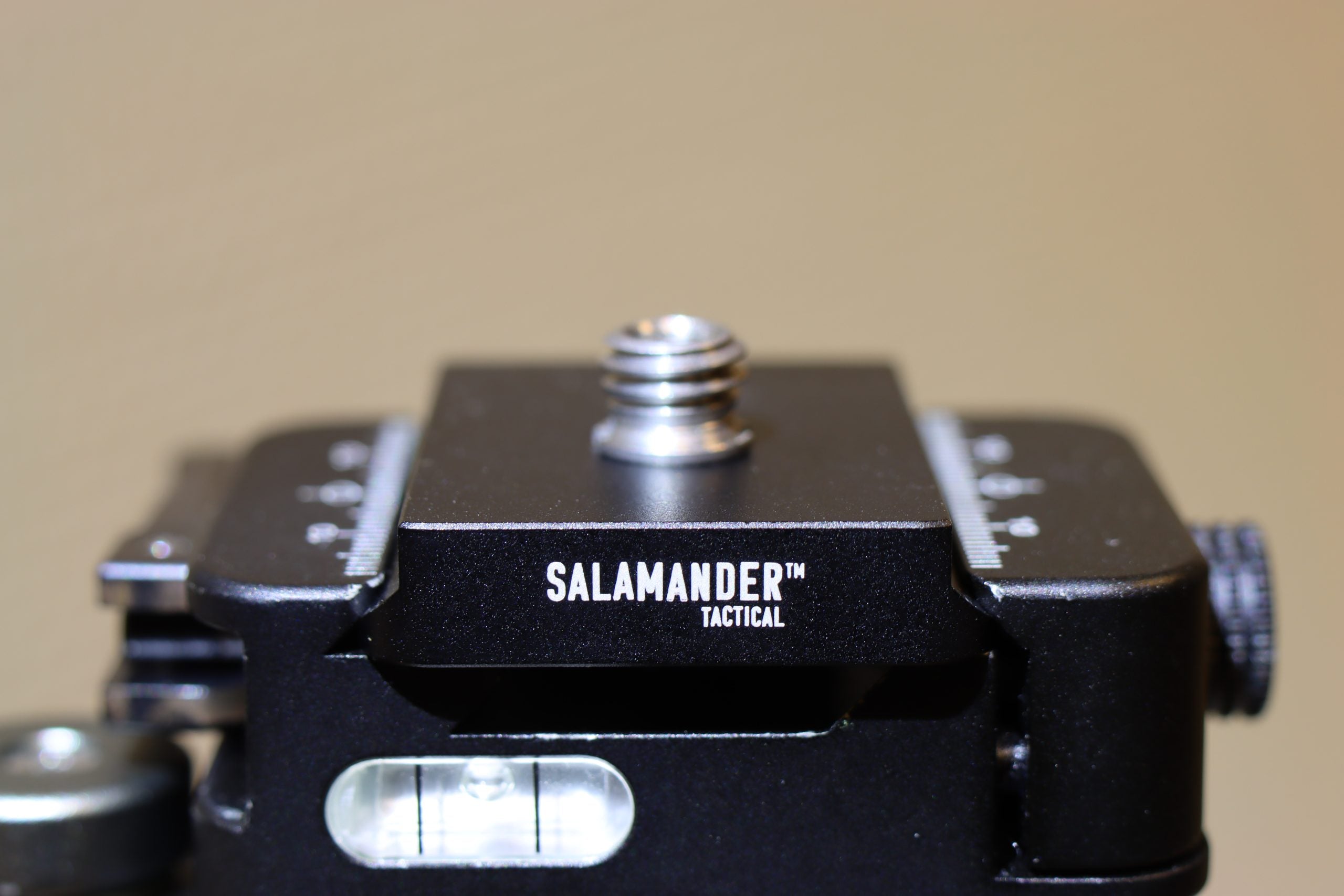 Arcaplate with anti rotation pin for spotting scope on a tripod head for secure mounting.